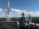 David Hazen standing atop the Blue Hill Observatory tower.